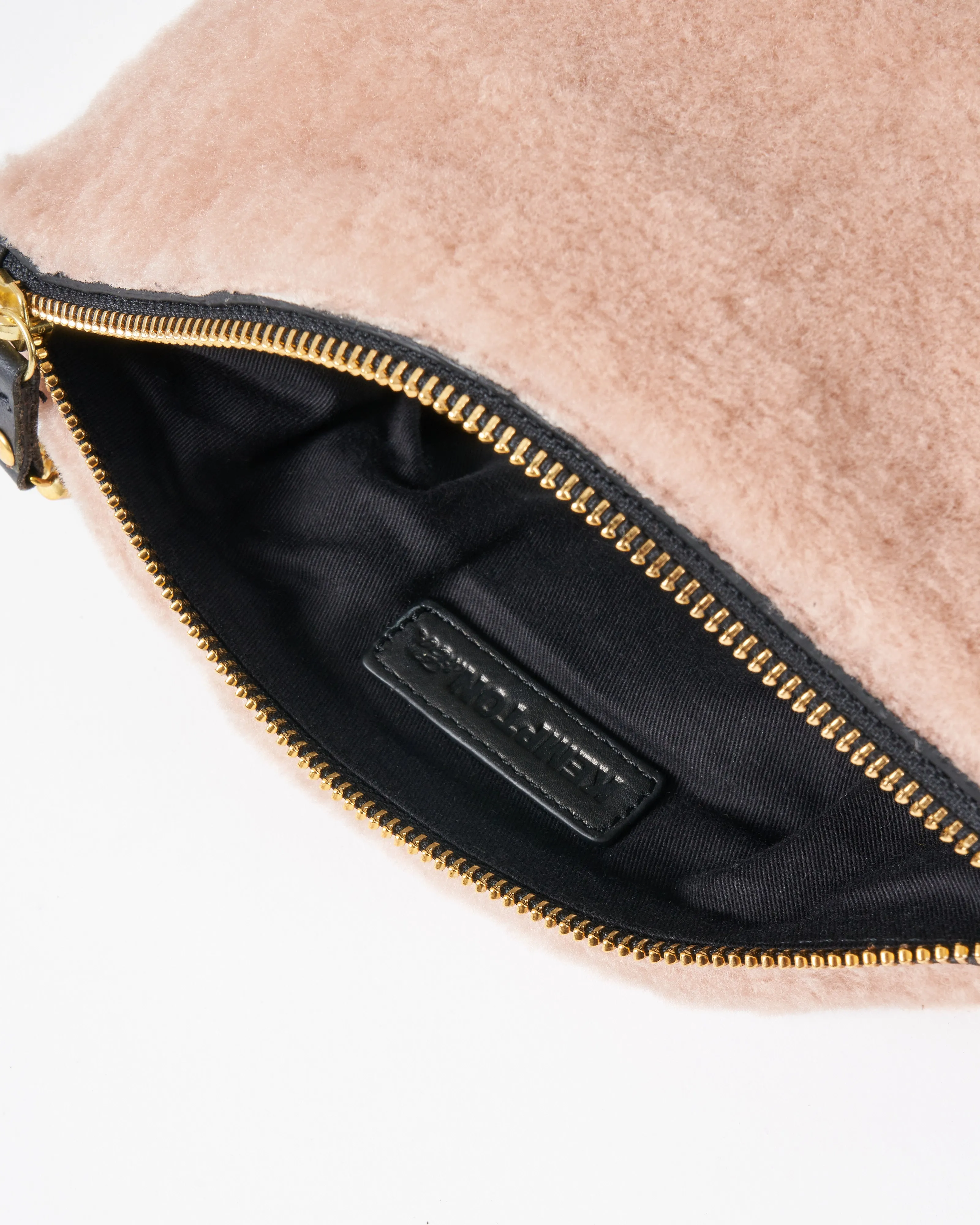 blush shearling makeup bag